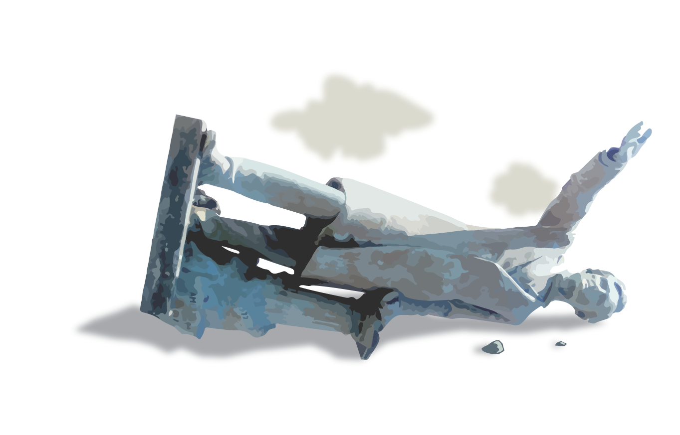 A statue of Jefferson Davis that is knocked over. 